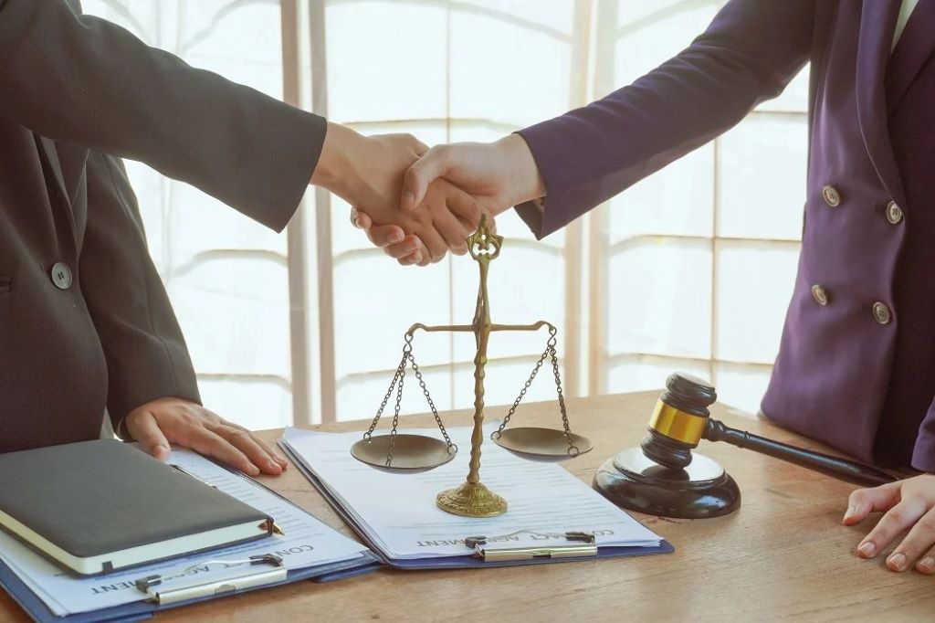 Nonprofit leaders consulting a lawyer about legal support and compliance for nonprofit organizations